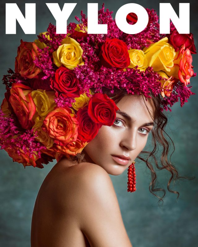 Nylon Español editorial page featuring Julie Pallesen wearing a crown of red and orange flowers