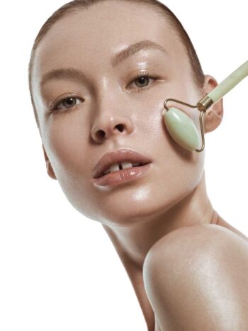Viki Foti with glowing skin and a jade face roller, Marie Claire Indonesia skin-care story