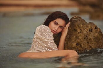 Schaeffer Studios Fashion Photographer Featuring Zorelys Lisboa Leaning on Rock
